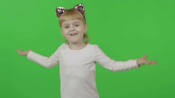 Girl in Headband with a Cat Ears Dancing. Happy Four Years Old Child. Chroma alt