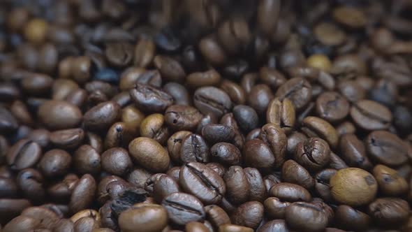 Coffee Grains Fall On Other Coffee Beans