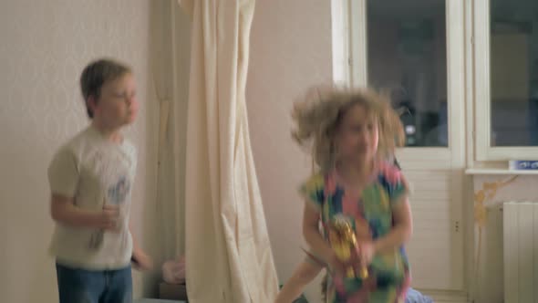 Boys and girls excitedly jumping around alt