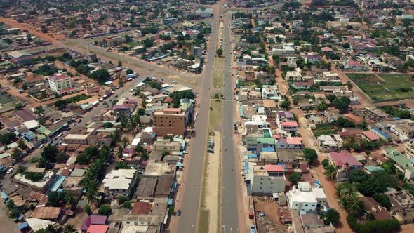 CInematic forward motion Aerial View of african city road, Lomé, Africa alt