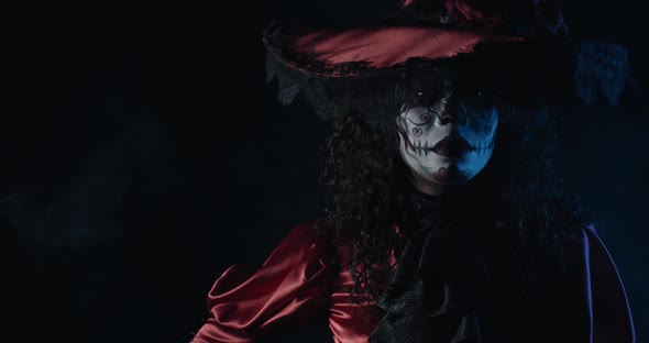 White Skull Is Painted on a Womans Face Santa Muerte Old Red Dress Film Grain alt