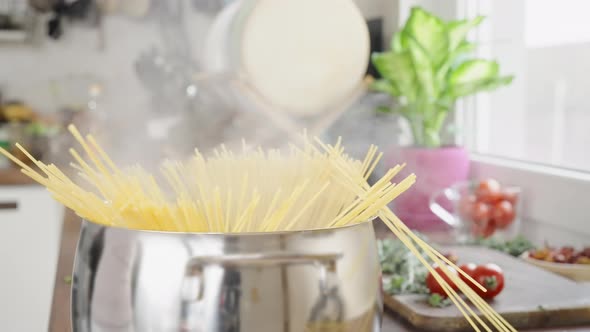 Throwing Pasta Into Water alt