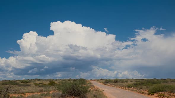 Storm Cell Over Dirt Road Wide Shot