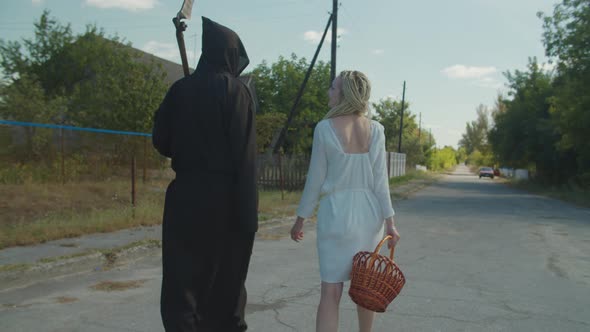 Cheerful People in Costumes Celebrating Halloween alt