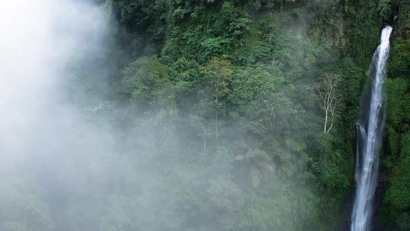 Panning Across a Large Waterfall Into Thick Mist