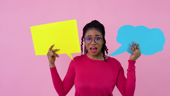 Cute Young African American Girl in Pink Clothes Stands with Posters for Expression on a Solid Pink alt