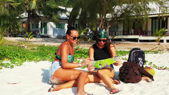 Beautiful Beauty Models on Holiday Spending Quality Time at The Beach on Paradise White Sand alt