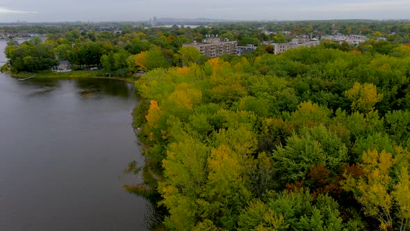 4K camera drone captures fall season colors during flight over the Montreal suburbs, in Canada.