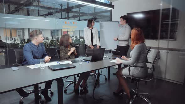Business Partners Shaking Hands After Making Deal in Office alt
