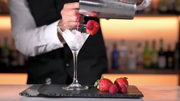 Expert Barman is Making Cocktail at Night Club alt