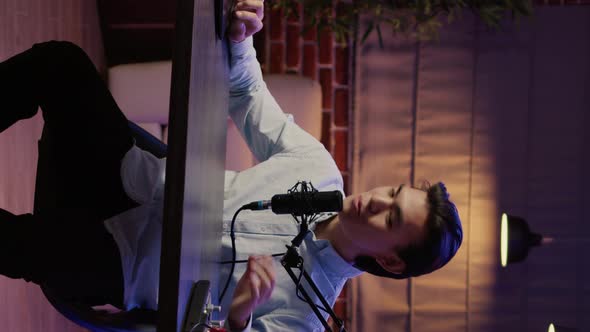 Vertical Video Podcast Presenter Recording Video Episode on Camera alt