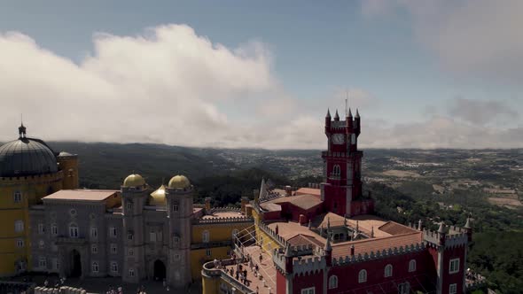 Visitors at the Pena Palace, jewel in the crown of Sintra Hills, Portugal. alt