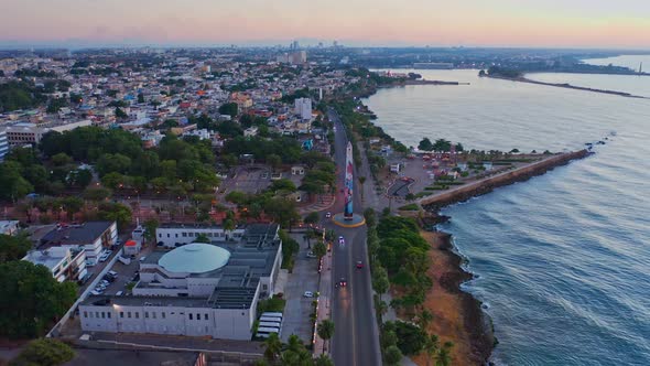 Forward flight with drone on the boardwalk of Santo Domingo early in the morning alt