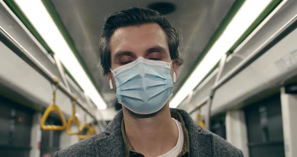 Close Up View of Man in Protective Medical Mask Looking To Camera alt