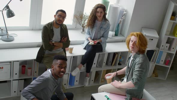 Four Multiethnic Colleagues Smile at Camera alt