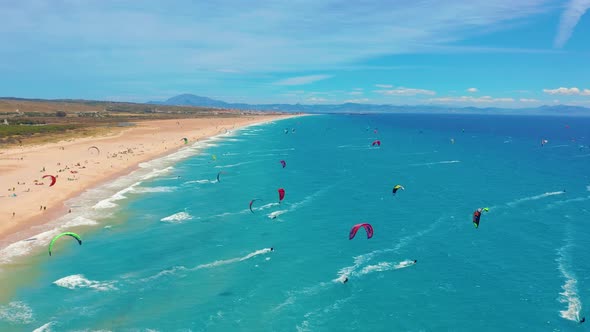 Large Beach Filled with Kite Surfers in Tarifa, Spain alt