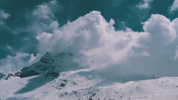 Landscape View of Alpine Mountain Snowy Peak in the Clouds. Simplon Pass. alt