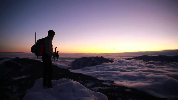 Mountaineer on viepoint at sunset, Orobie Alps, Lecco, Italy alt