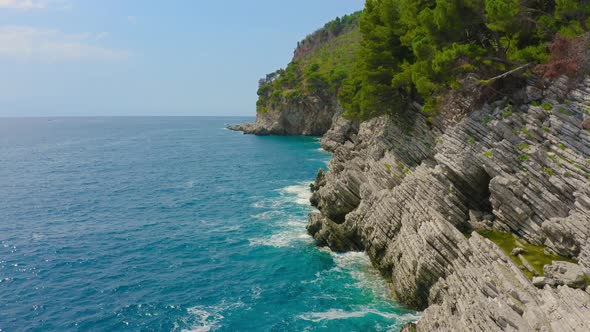 Aerial View of the Coastal Rocks and Sea Turquoise Waves Petrovac Montenegro alt