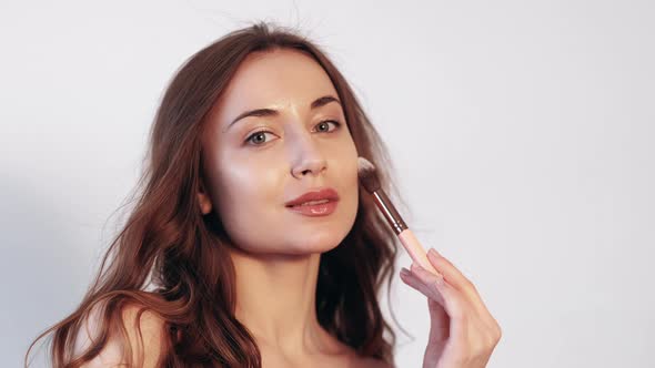 Daily Makeup Woman Apply Foundation with Brush alt