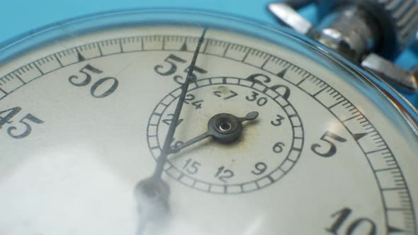 Analogue Metal Stopwatch on Blue Background