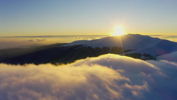 Wonderful View of Extraordinary Cloudy Valley and Bright Orange Sunset alt