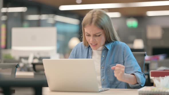 Young Woman Feeling Angry While Using Laptop alt