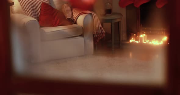 Wreath with heart shape decoration hanging on door alt