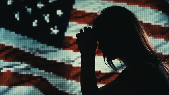 Female Grieving. USA Flag Background