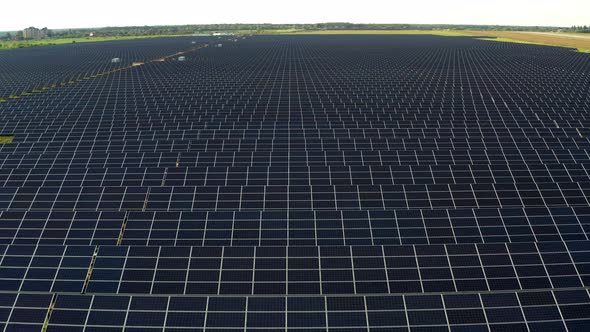 Top view of the power plant with solar panels and the aerodrome. Beautiful green fields. alt