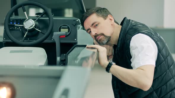 A Man Is Checking Out a New Powerboat alt