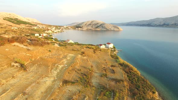 Flying above vacation houses on the island of Pag alt