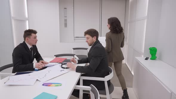 Live Camera Follows Confident Professional Businesswoman Entering Meeting Room Talking to Employees alt