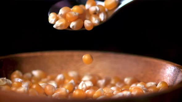 Super Slow Motion Popcorn Grains Fall From Spoon to Plate alt