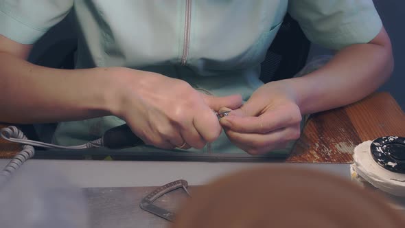 The Master Performs a Prosthetic Jaw for the Installation of Dental Implants alt