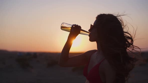 Young Hispanic Woman in Bikini Drinking Beer on Summer Holidays