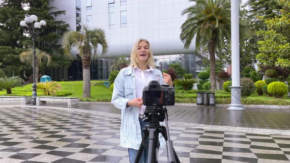 Blogger Filming Herself on Camera in the City