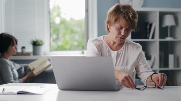Tired Woman with Laptop