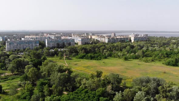 Aerial View of Multi-Storey Buildings at Sleeping Area of Small City Near Forest alt