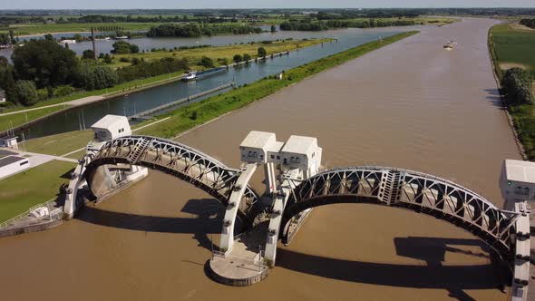 Lock and weir In Dutch River Lek Called Sluice Hagestein, aerial alt