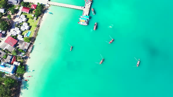 Beautiful drone clean view of a white sand paradise beach and aqua blue ocean background  alt