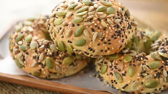 Multigrain mixed cereal seed healthy bread buns in wooden plate