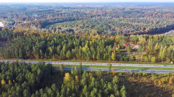 Latvia, A2 Highway Autumn Landscape From Above. Gauja River With Bridge and Ramkalni in Background. alt