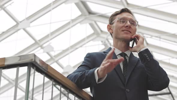Elegant Businessman Making Phone Call alt