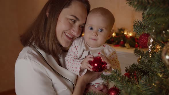 Mom Celebrates the First Christmas with Her Daughter