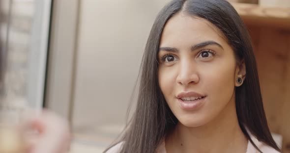 Ethnic Businesswoman Speaking Looking at the Camera alt