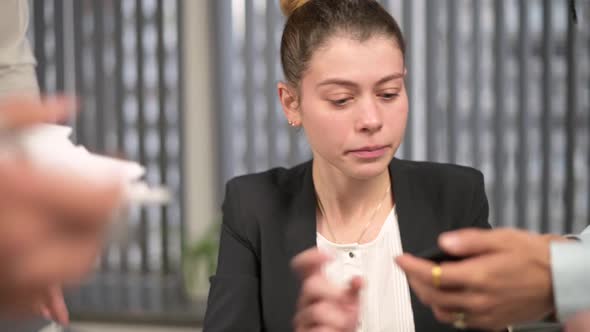 Colleagues and bosses overwhelmed a young woman manager with work alt