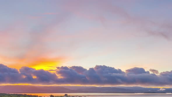 Fog over mountains with sun light. alt