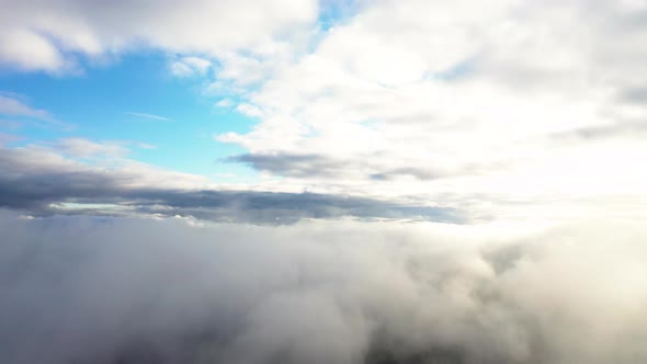Flight through the moving cloudscape. Texture of clouds. Panoramic view. 