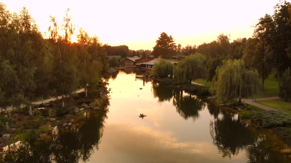 Aerial Landscape of Park Pond and Sunset Shine alt
